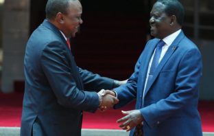 President Uhuru Kenyatta and NASA leader Raila Odinga shake hands after their meeting on March 9, 2018. /JACK OWUOR